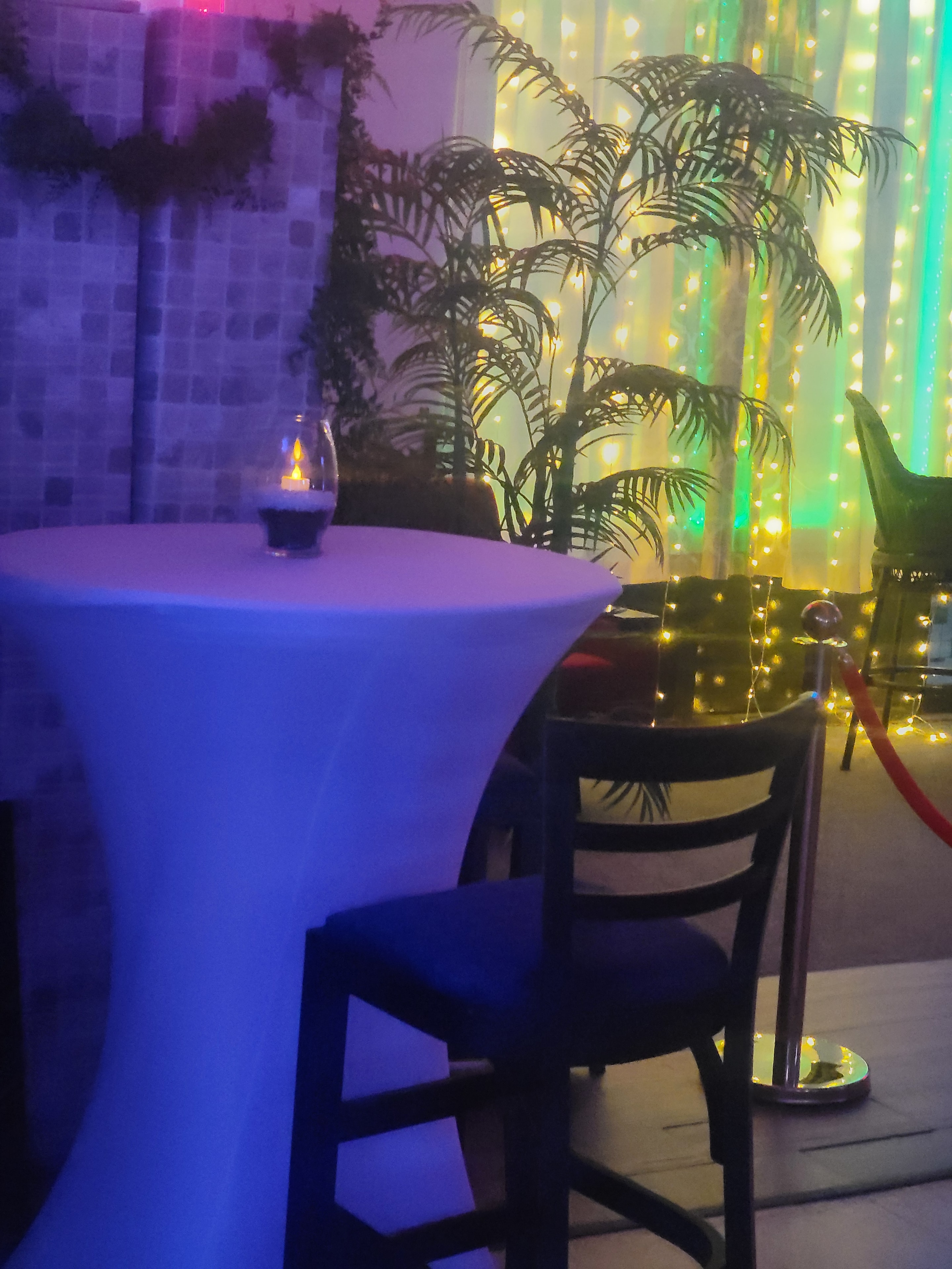 Elegantly decorated event space with floral installation